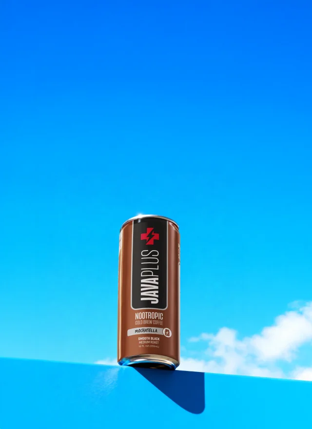 A JavaPlus can against a bright blue sky