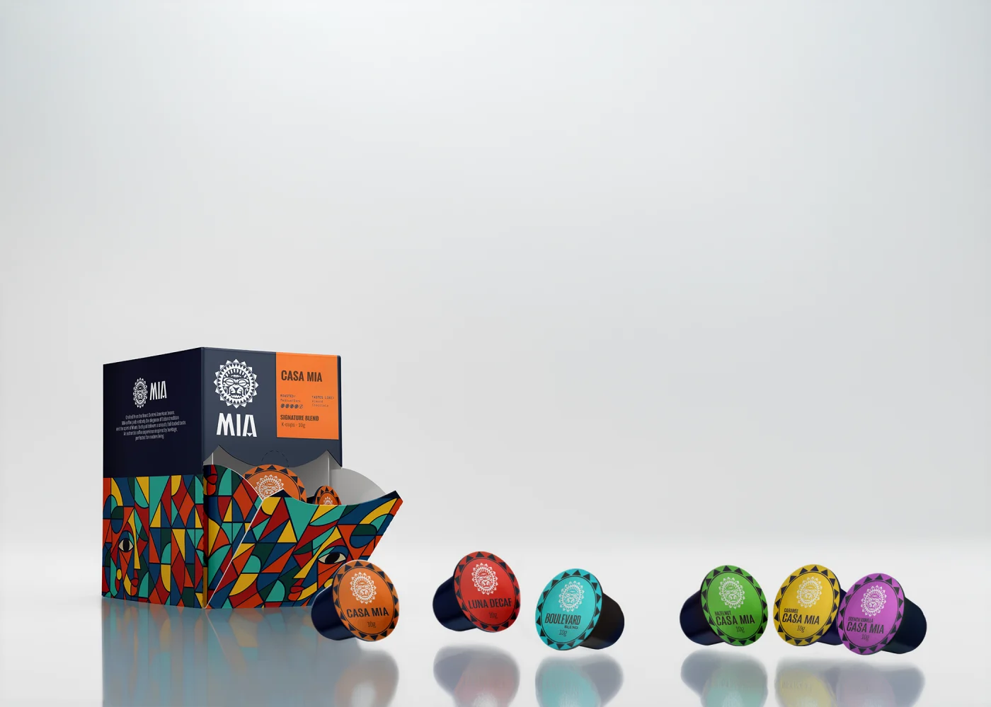 Casa Mia espresso capsule box with the full range of color-coded Mia pods fanned out beside it